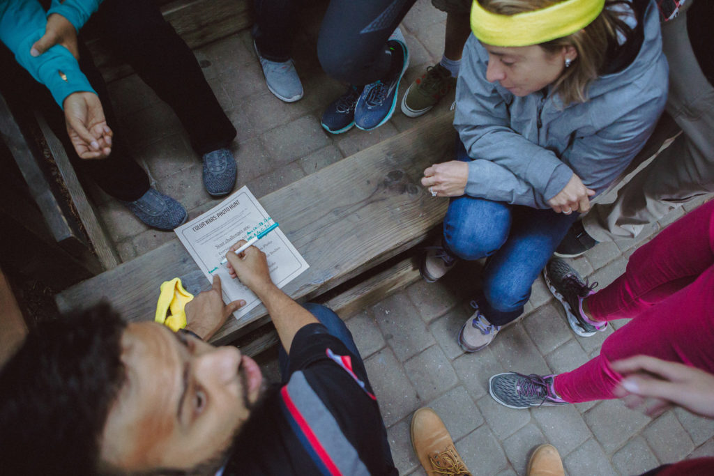 Teams cheering during a Color Olympics challenge
