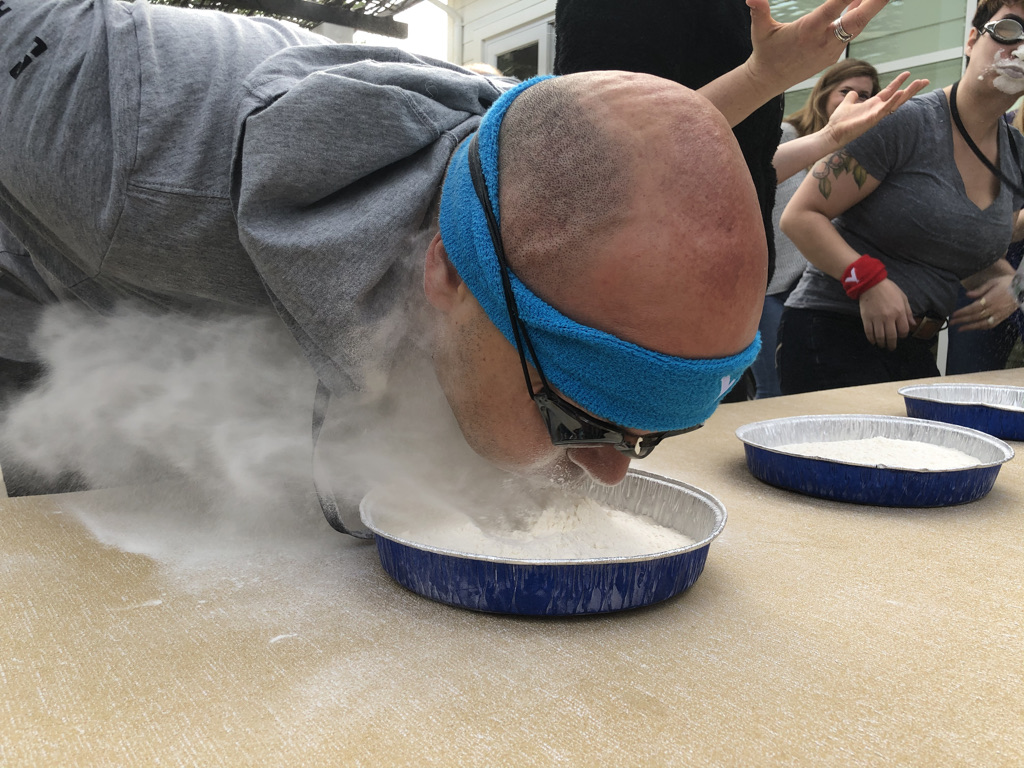 A minute-to-win-it relay race challenge at Color Olympics