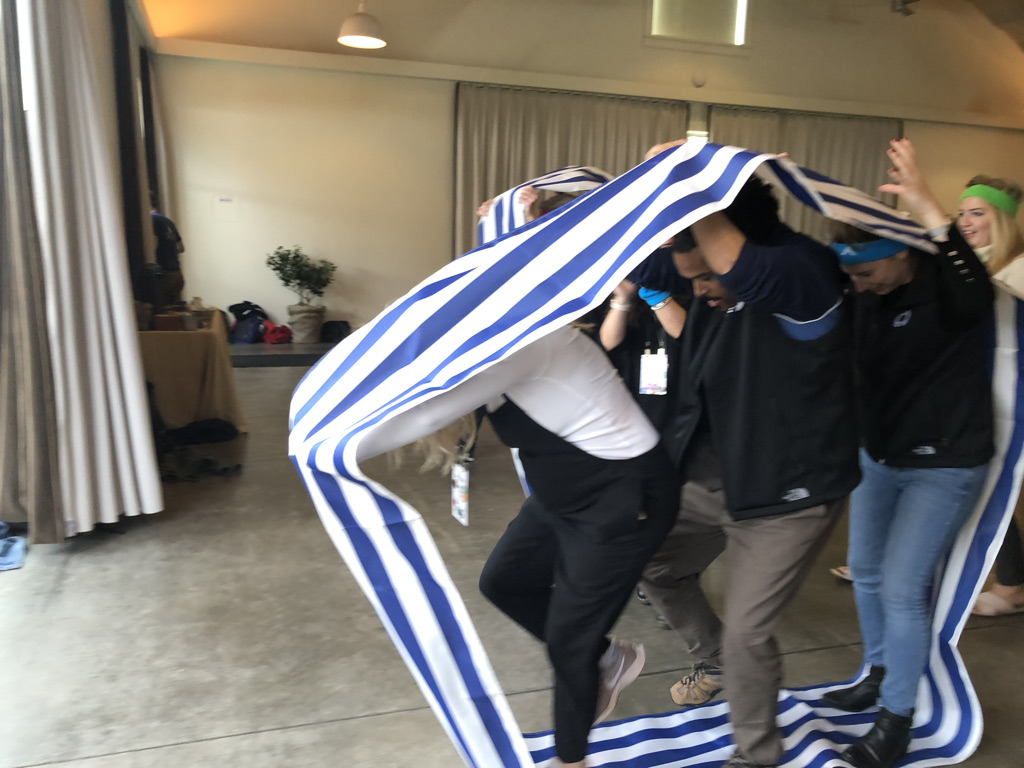 Color team members working together during a challenge